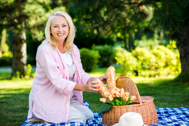 Happy old woman looking at camera