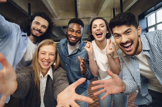 Free photo happy overjoyed business team celebrate corporate victory