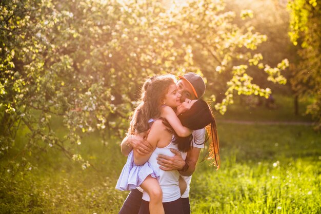 Happy parents enjoying with their daughter in park