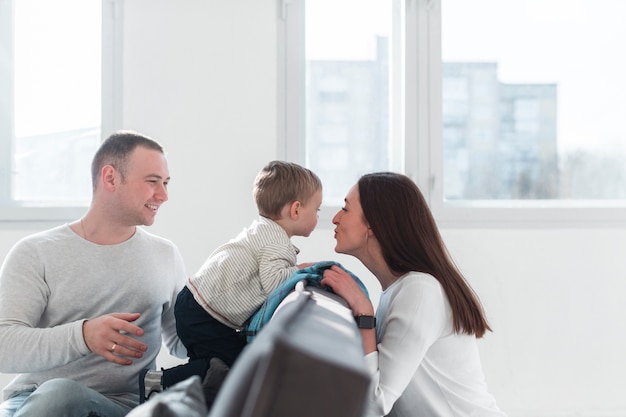 Happy parents at home with baby