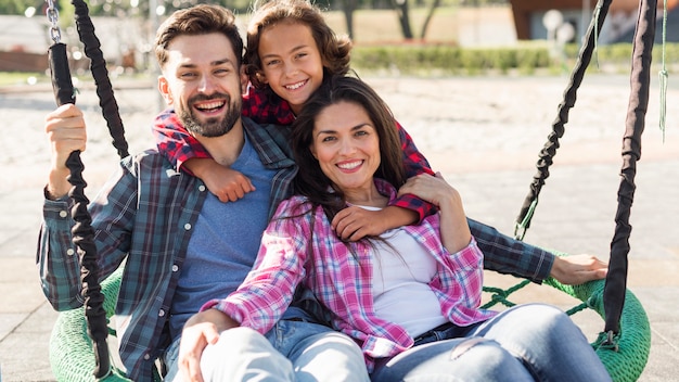 Happy parents and son together at the park