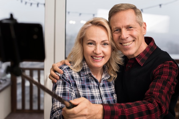 Free photo happy parents taking a selfie