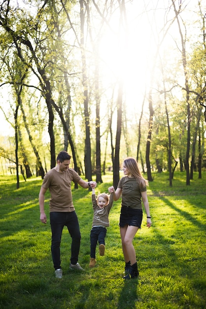 Happy parents with child in nature