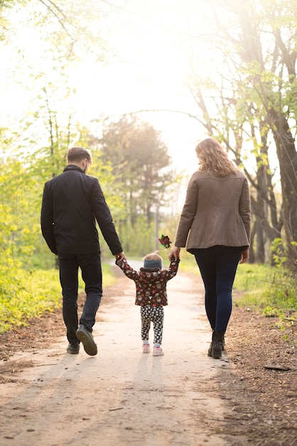 Happy parents with child in nature