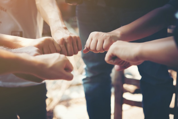 Free photo happy partnership community hands stacking