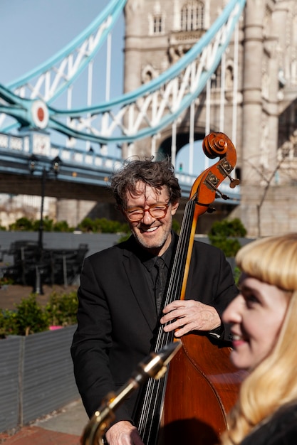 Free Photo happy people making jazz music in uk