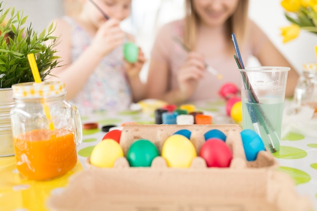 Happy people painting eggs