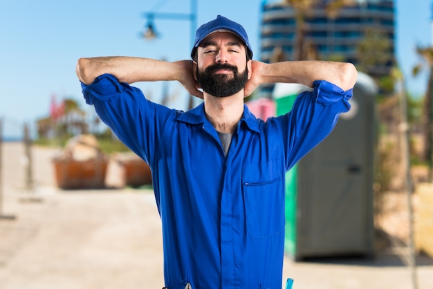 Happy plumber man