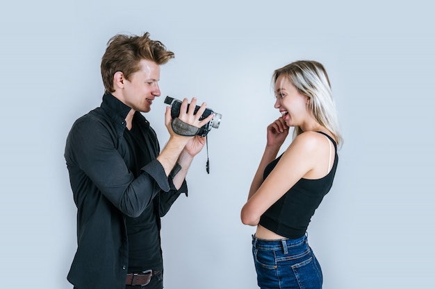 Happy portrait of Couple holding Video camera and Record clip video