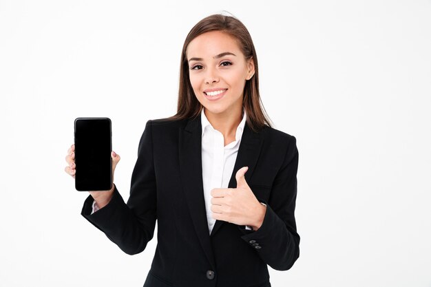 Happy pretty businesswoman showing display of mobile phone.