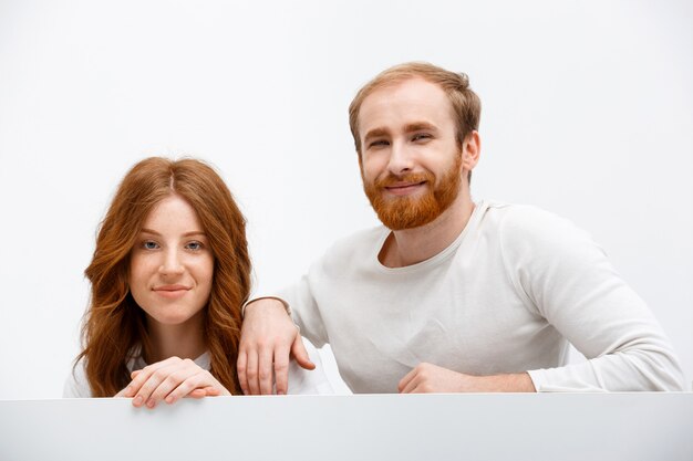 Happy redhead man and woman smiling