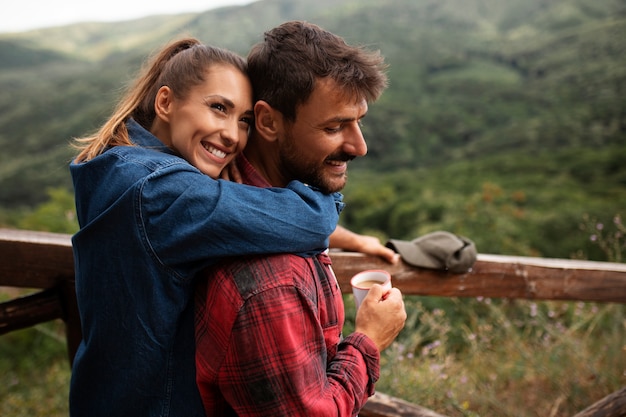 Free Photo happy and romantic couple traveling together in nature