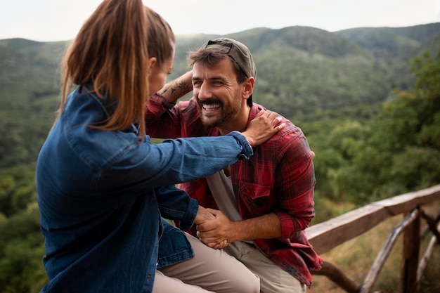 Free photo happy and romantic couple traveling together in nature