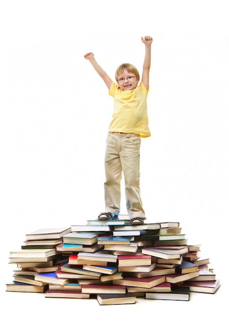 Happy schoolboy with arms up