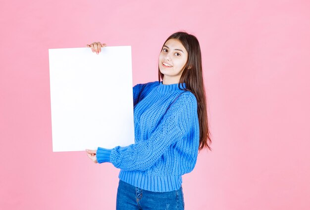 happy smiling girl with white blank board.