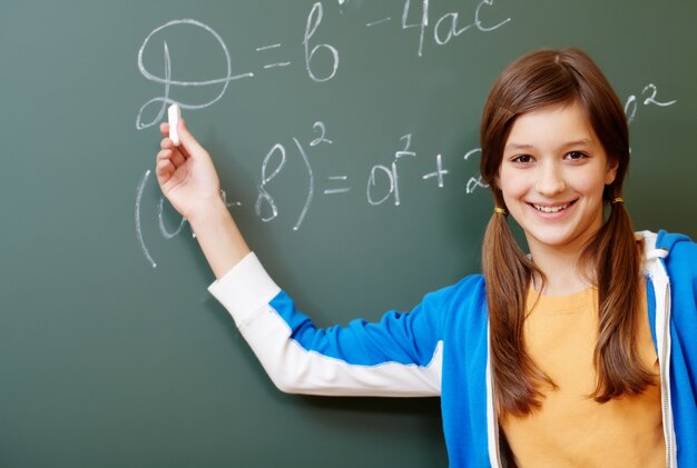 Happy student on the blackboard