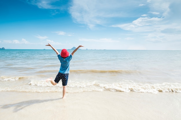 Happy Woman on the beach and clouds  sky.