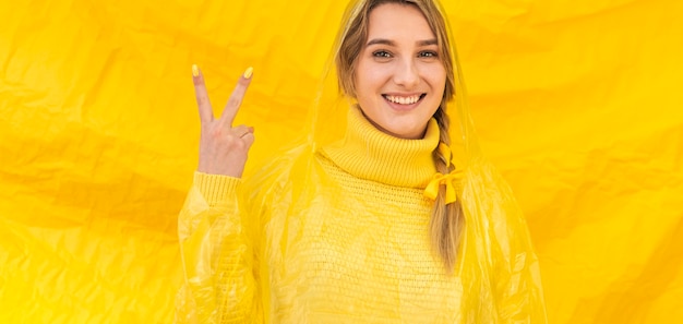 Happy woman doing peace sign