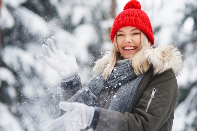 Happy woman having fun over winter