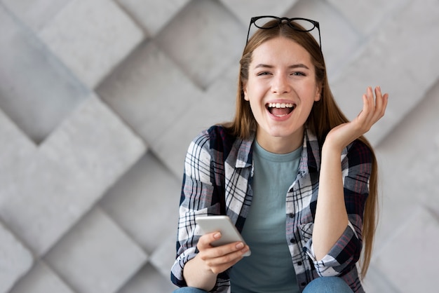 Happy woman having her glasses on her head