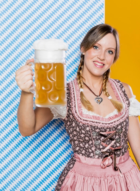 Happy woman holding beer mug