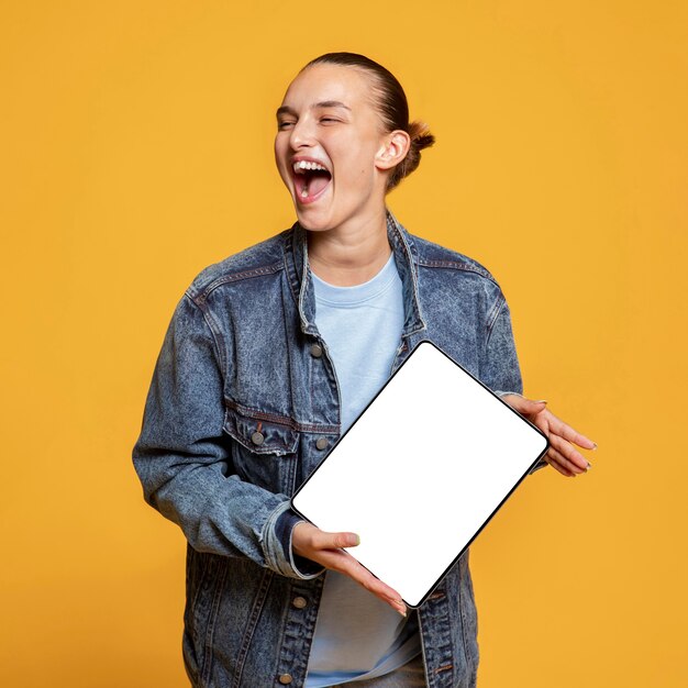 Happy woman holding tablet