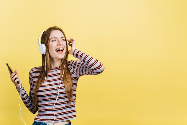 Happy woman listening to music