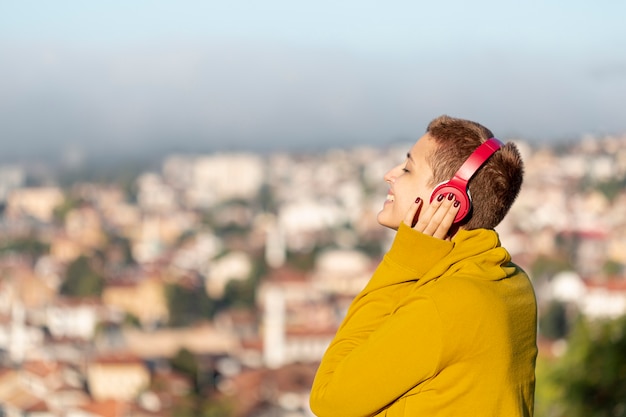 Happy woman listening to music