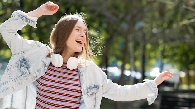 Free Photo happy woman listening to music