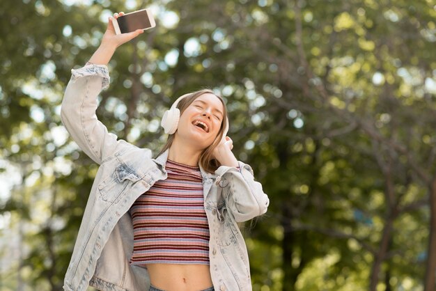 Happy woman listening to music