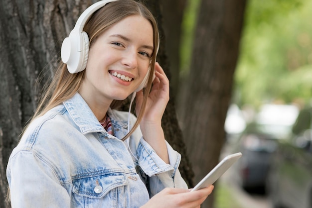 Free photo happy woman listening to music