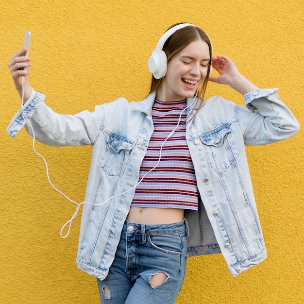 Free Photo happy woman listening to music