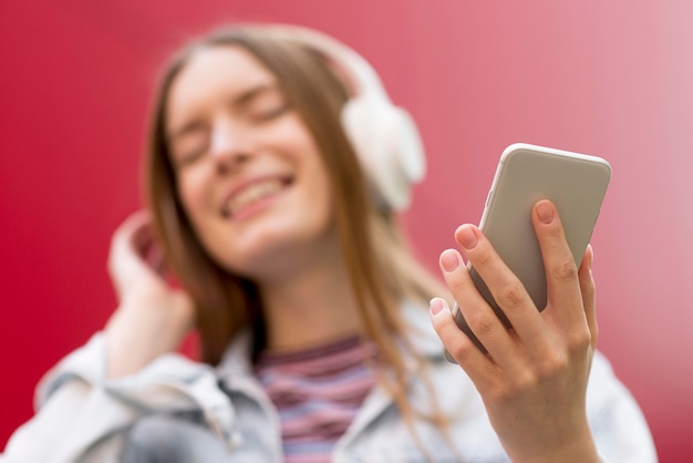 Free Photo happy woman listening to music