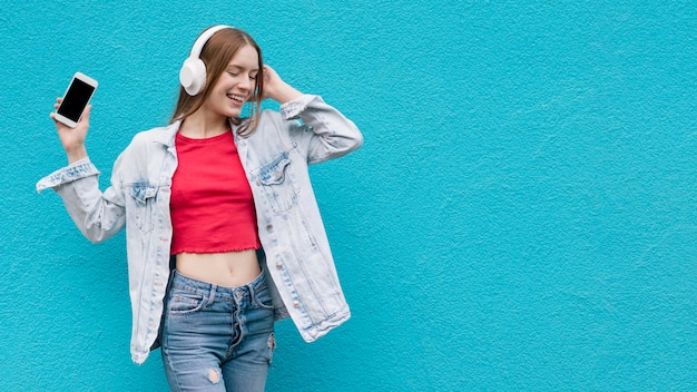 Happy woman listening to music