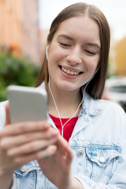 Free Photo happy woman listening to music