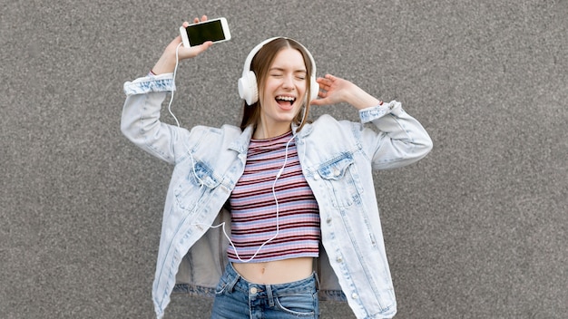 Happy woman listening to music