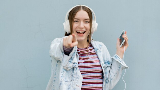 Happy woman listening to music