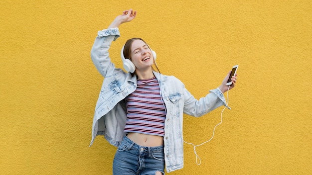 Happy woman listening to music