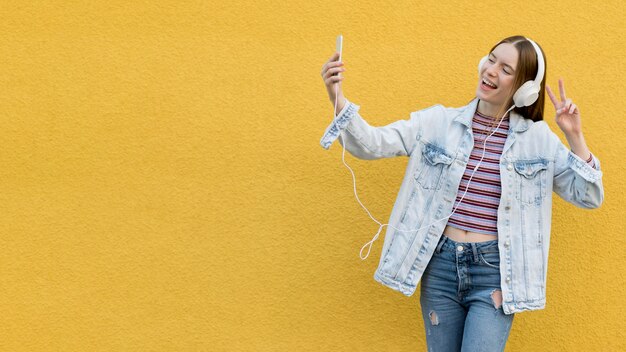 Happy woman listening to music