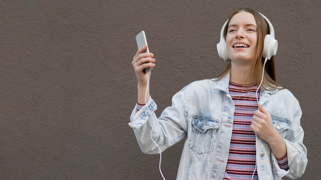 Free Photo happy woman listening to music