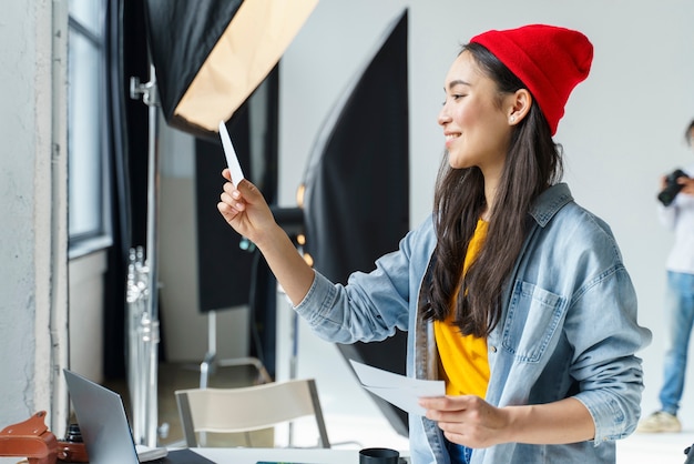 Free photo happy woman looking at photo