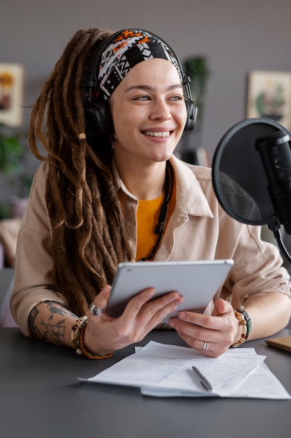 Free photo happy woman making podcast medium shot