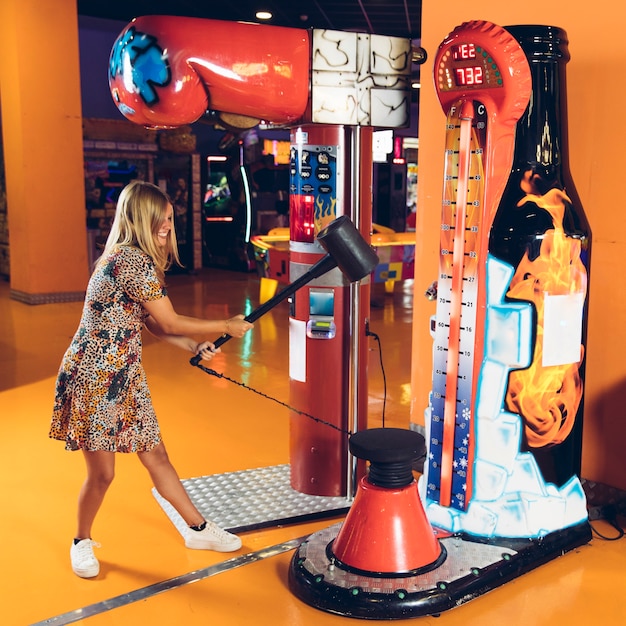 Free Photo happy woman playing arcade game