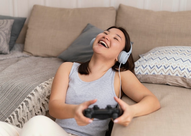 Happy woman playing videogame