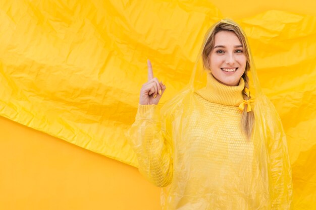 Happy woman pointing up