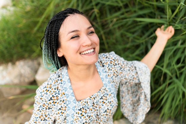 Happy woman posing outdoors