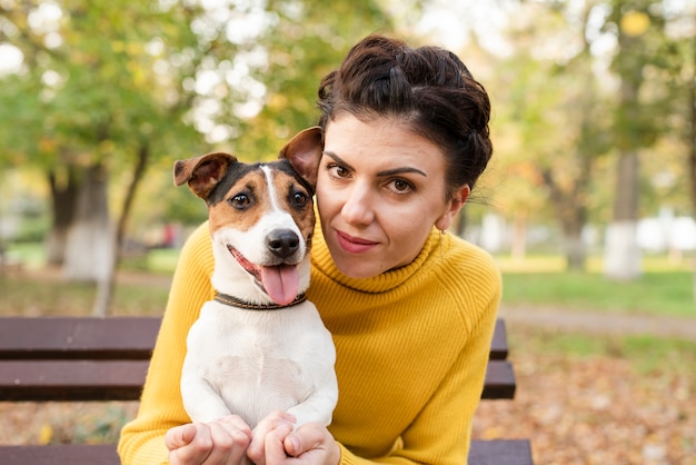 Happy woman posing with her dog