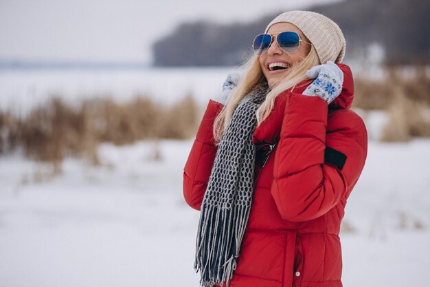 Free Photo happy woman in red jacket outside in winter