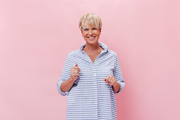 Free photo happy woman in shirt looks with smile into camera