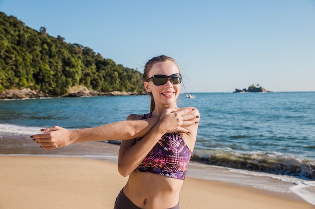 Happy woman stretching arms